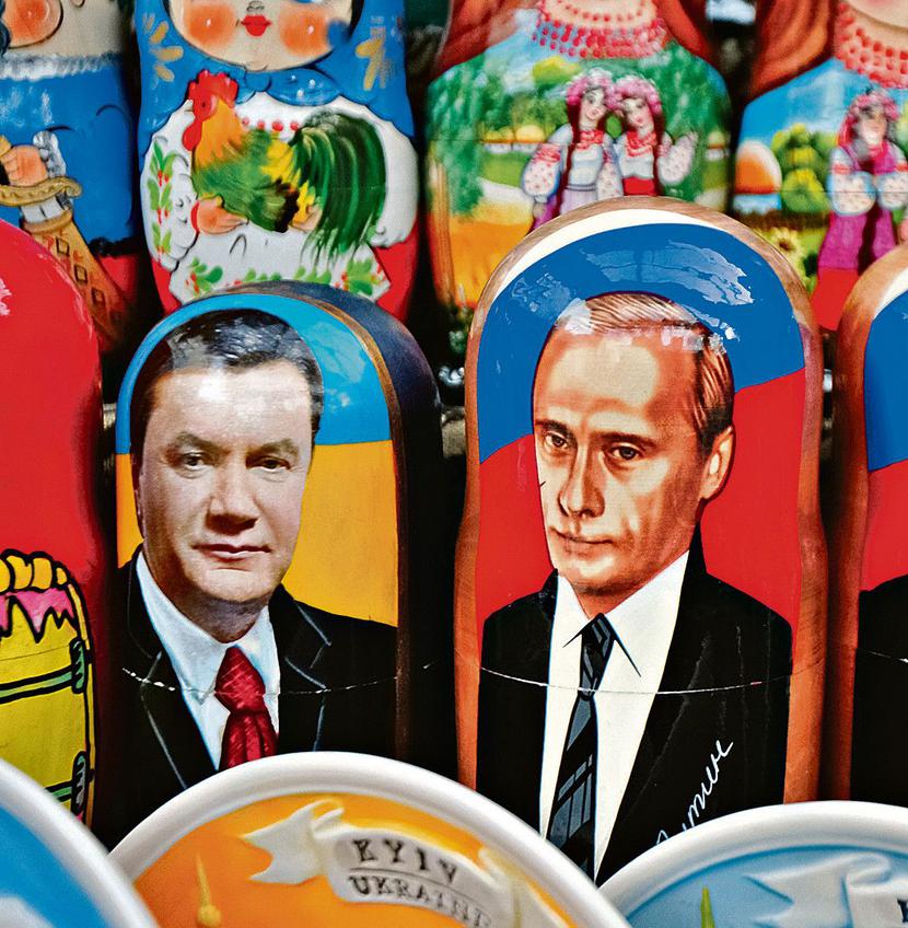 KŁOPOTLIWY WASAL: Brutalne metody Wiktora Janukowycza,
 to coraz większy problem dla wspierającego go Władimira Putina,
 prezydenta Rosji. [FOT. BLOOMBERG]